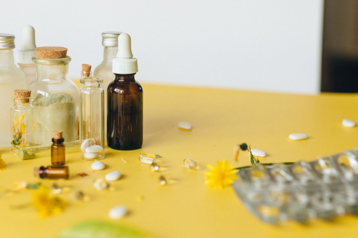thistle flower in traditional medicine jar