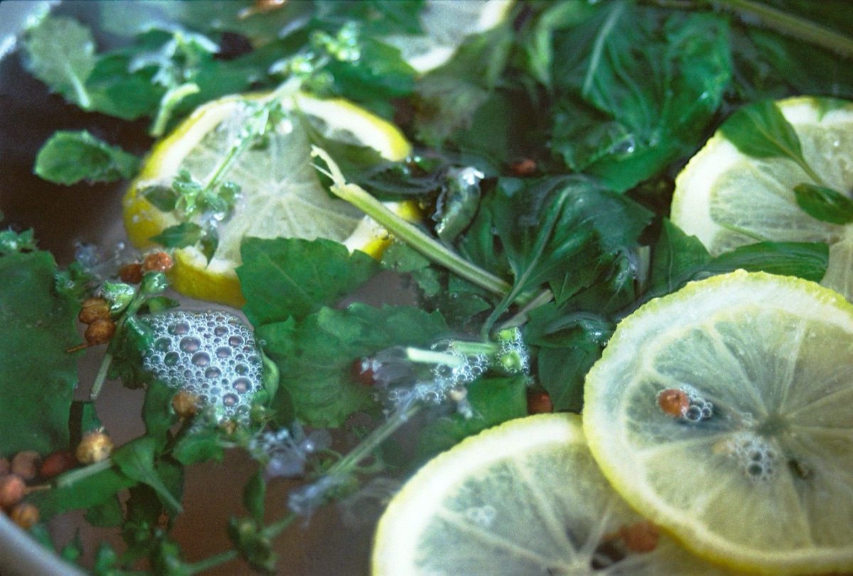herb infused water with lemon slice