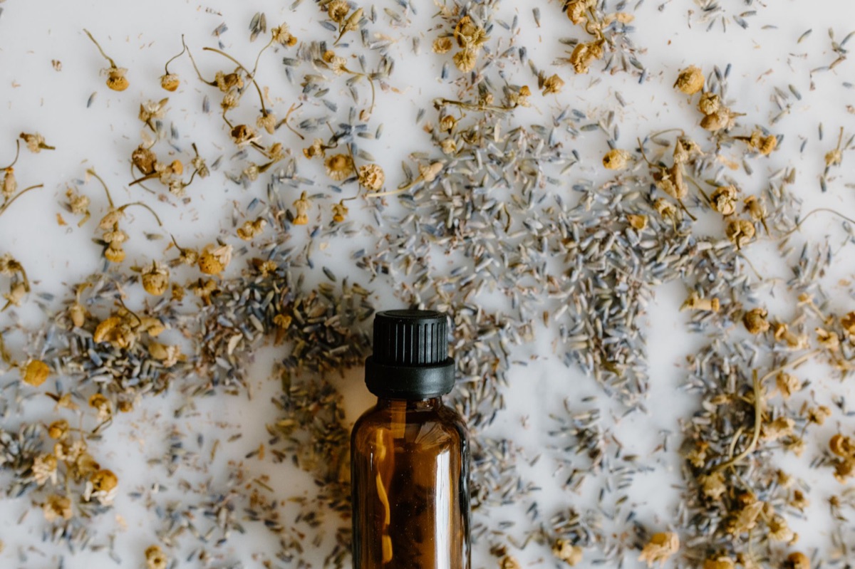 Modern herbal medicine bottle with natural ingredients and labels